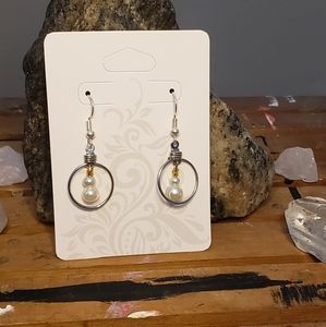 Homemade earing with white and gold beads